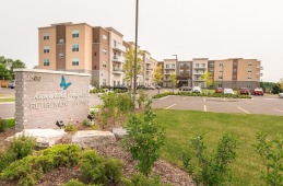 Kawartha Heights retirement residence in Peterborough featuring a modern building entrance and landscaped grounds.